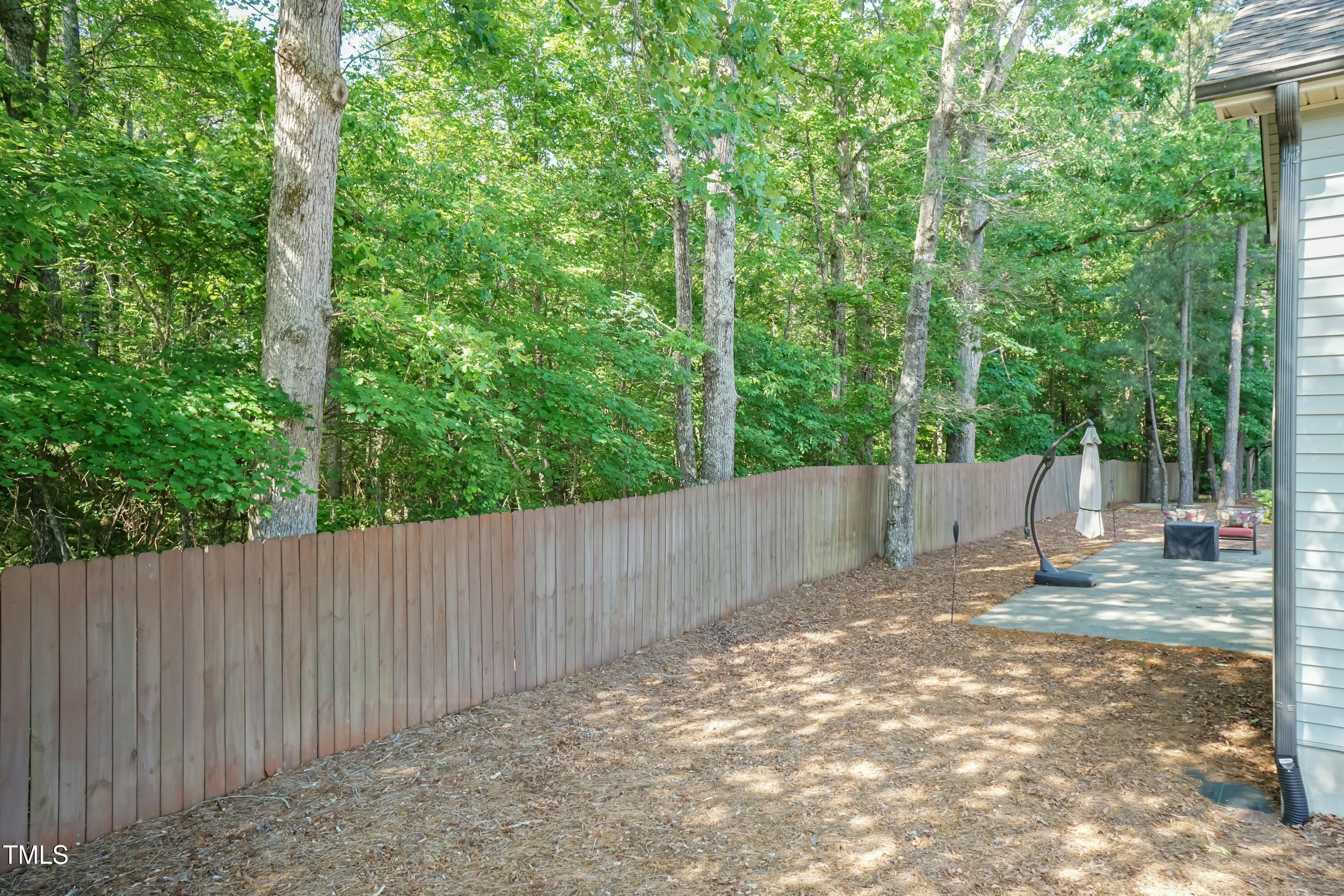 7660 Channery Way Raleigh, NC 27616 - Photo 31 of 42 a view of a backyard with trees