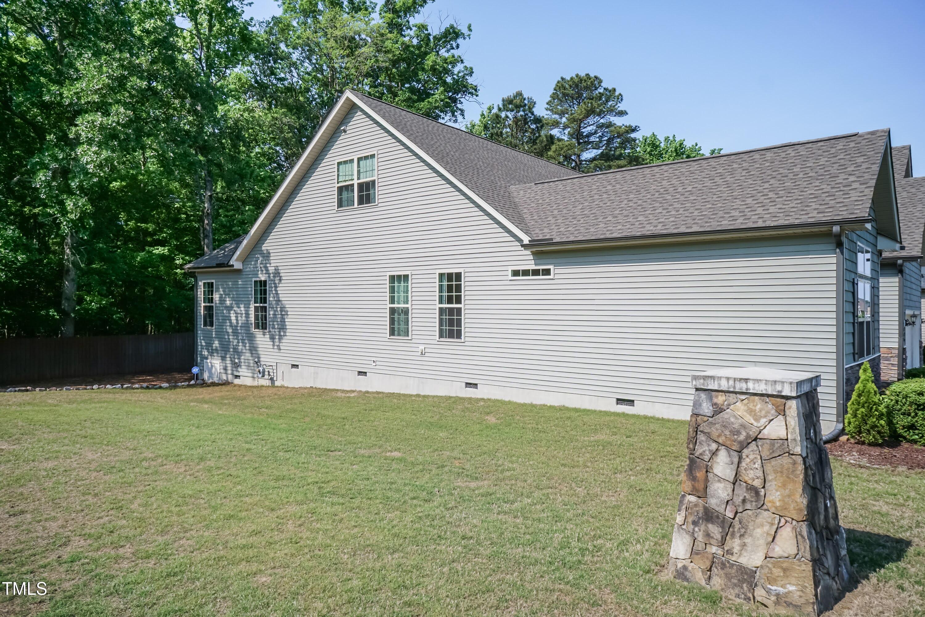 7660 Channery Way Raleigh, NC 27616 - Photo 33 of 42 a view of a backyard with a garden