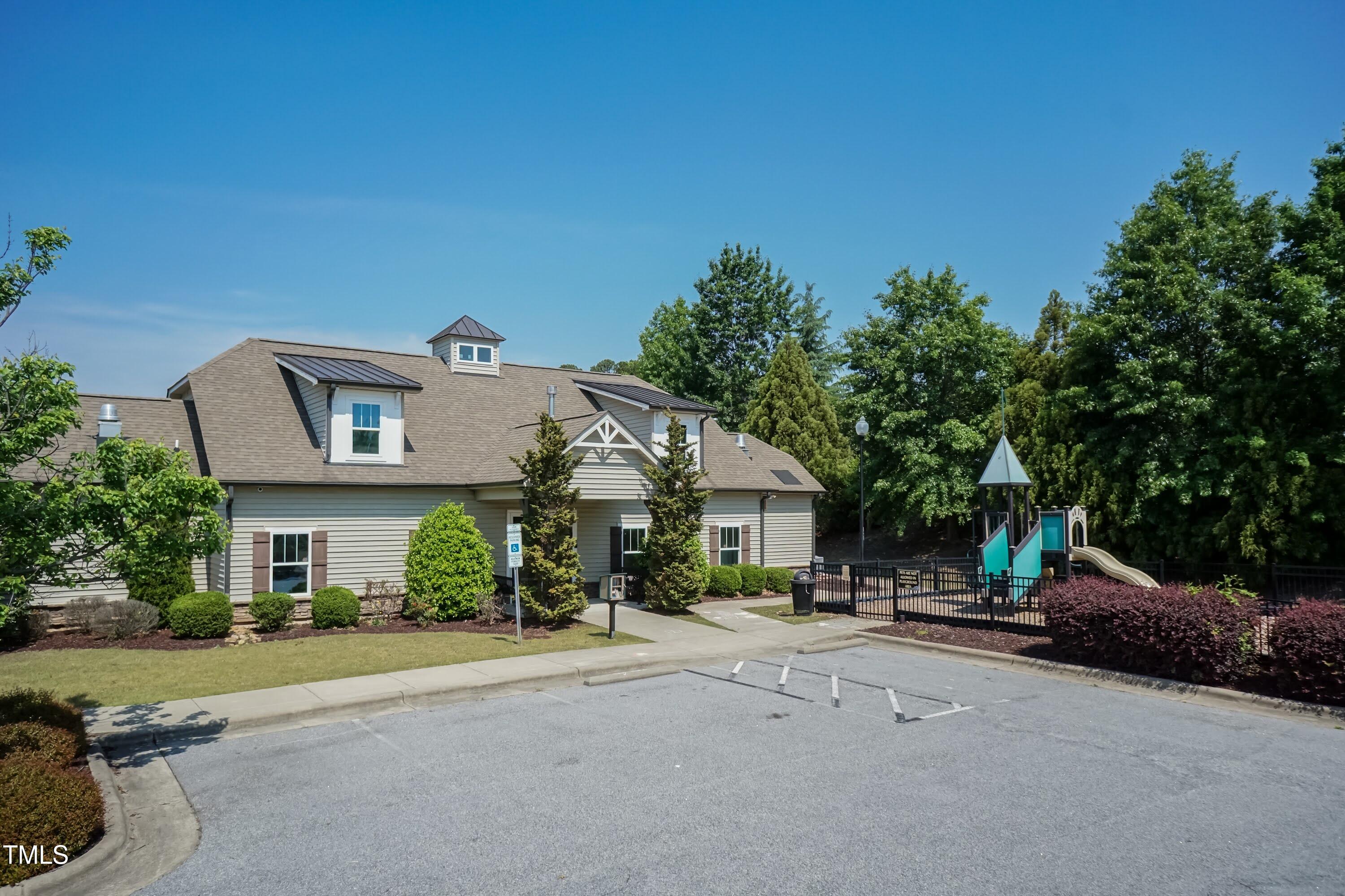 7660 Channery Way Raleigh, NC 27616 - Photo 37 of 42 a front view of a house with a garden