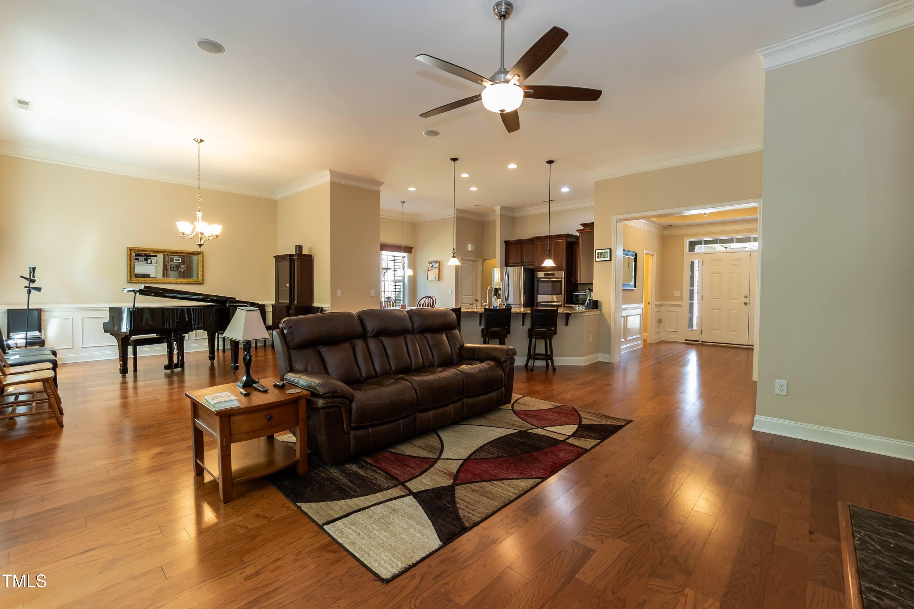 7660 Channery Way Raleigh, NC 27616 - Photo 7 of 42 a living room with furniture and wooden floor