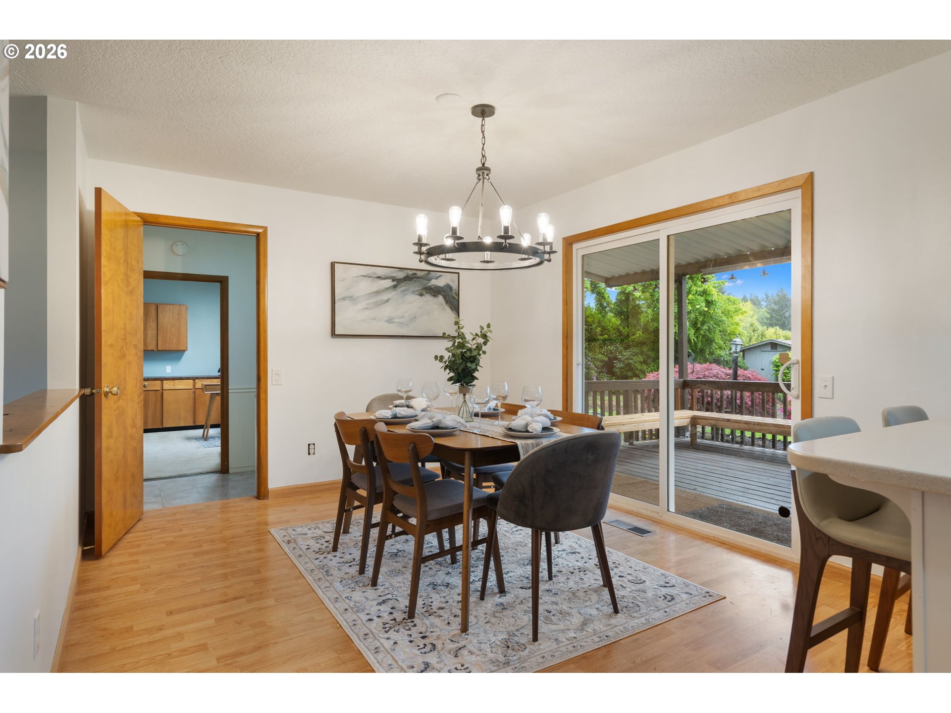 24950 Airport Road Northeast Aurora, OR 97002 - Photo 13 of 44 a dining room with furniture a chandelier and wooden floor