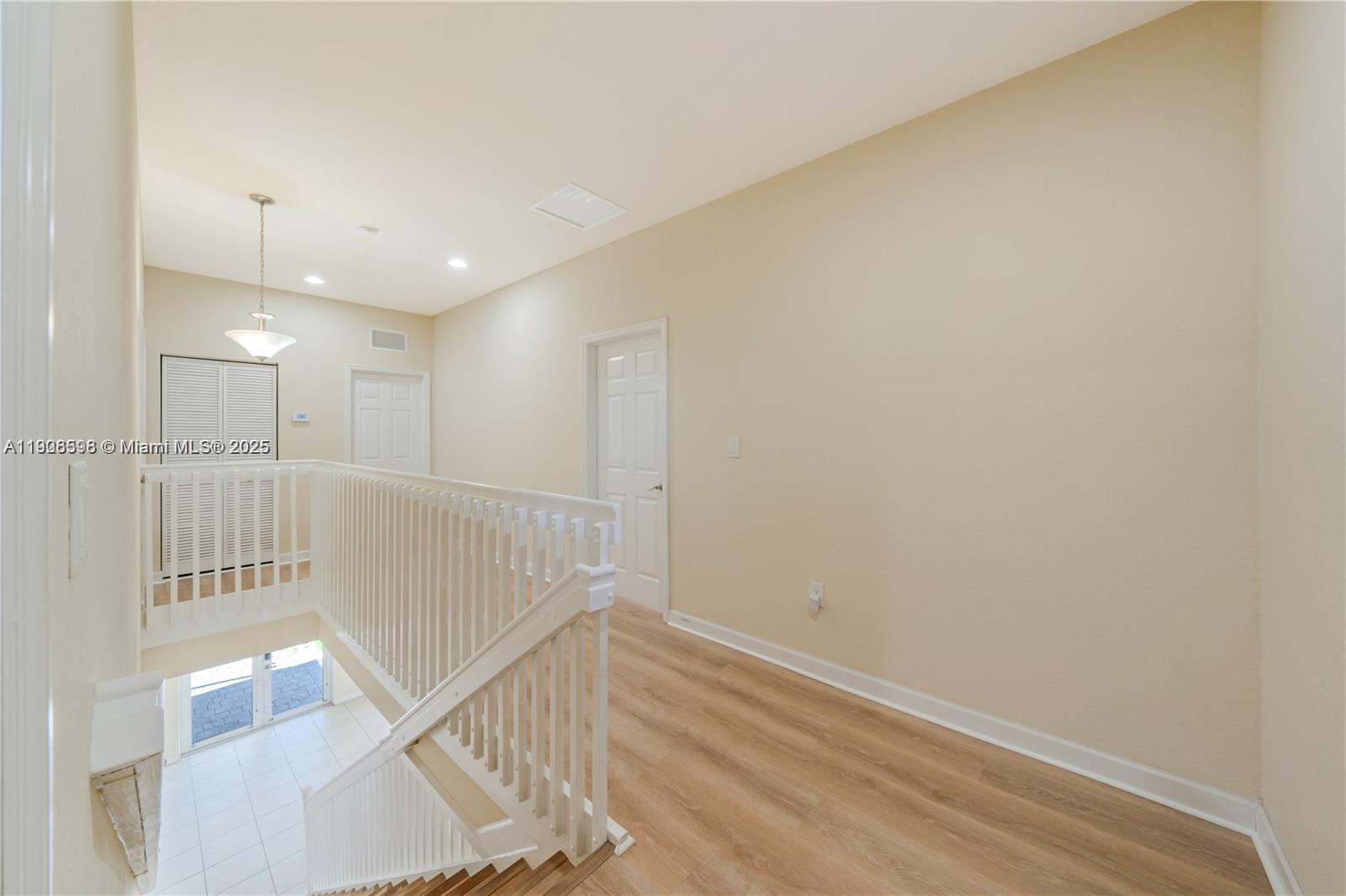 16946 Southwest 90th Terrace Circle Miami, FL 33196 - Photo 16 of 36 a view of an entryway with wooden floor