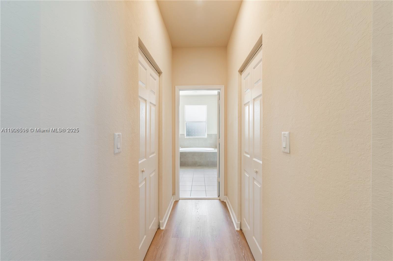 16946 Southwest 90th Terrace Circle Miami, FL 33196 - Photo 18 of 36 a view of a hallway with wooden floor