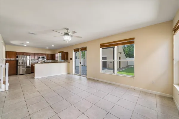 a view of kitchen with furniture and large window