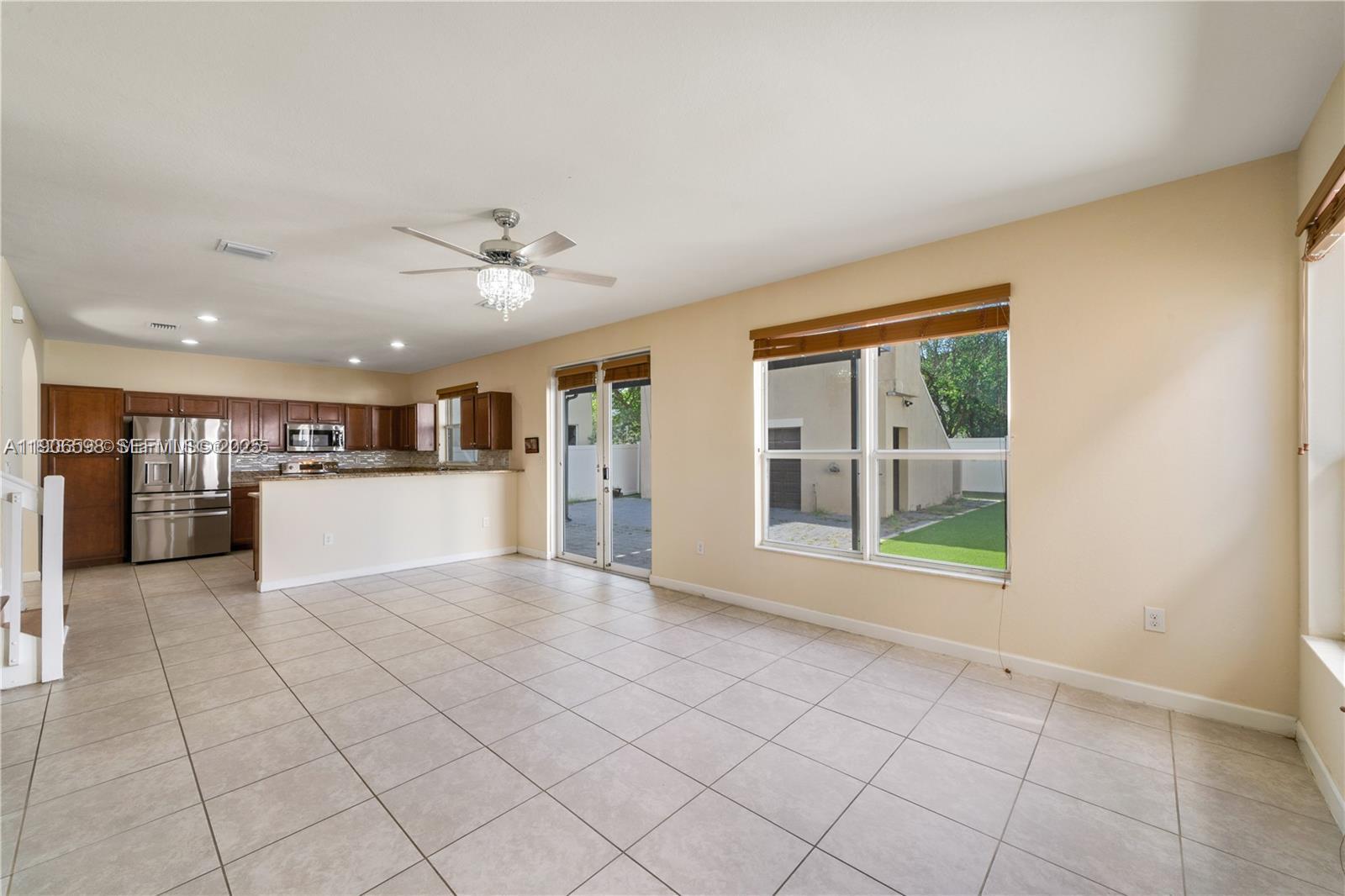 16946 Southwest 90th Terrace Circle Miami, FL 33196 - Photo 5 of 36 with kitchen and backyard view