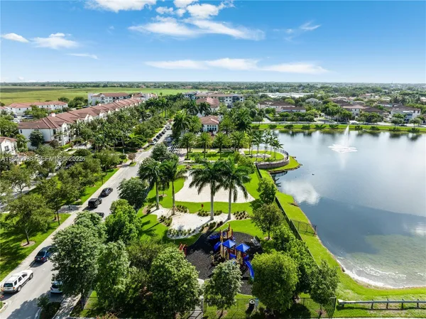 a couple of cars parked in front of a house