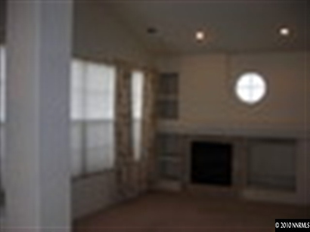 1279 Tule Drive Reno, NV 89521 - Photo 5 of 13 a view of empty room with a fireplace