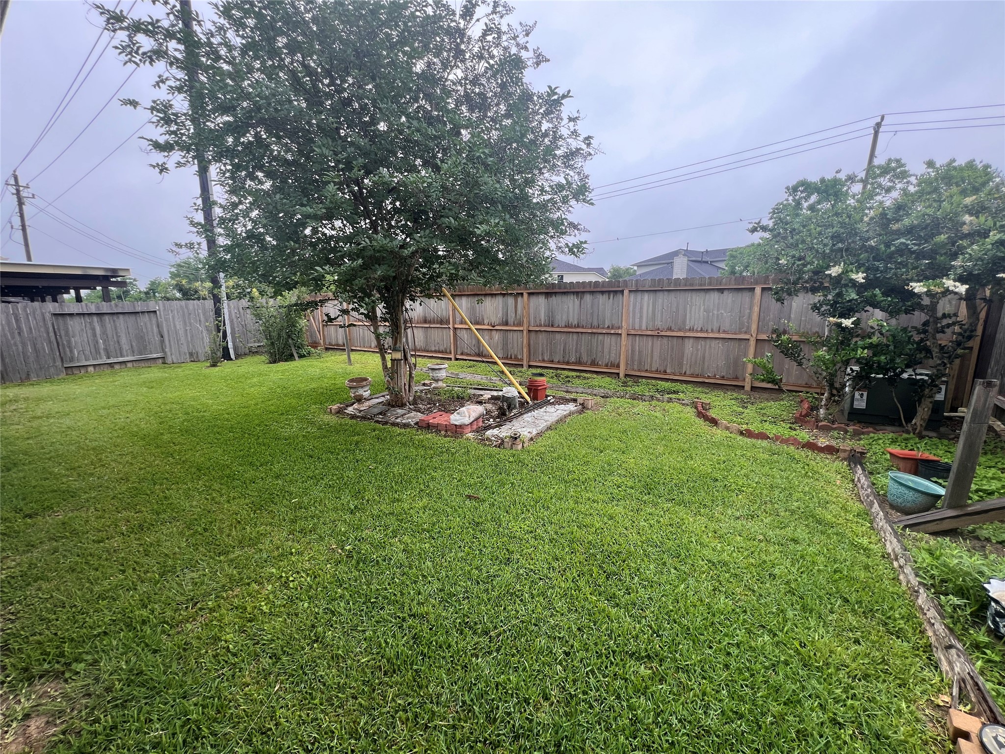 5410 Peppermint Lane Baytown, TX 77521 - Photo 22 of 22 With plenty of room to run, play, entertain, and relax, this backyard offers the perfect balance of open lawn and shaded outdoor living space.