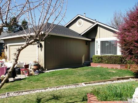 7400 Maximillian Place Rohnert Park, CA 94928 - Photo 1 of 1 a backyard of a house with plants and large tree