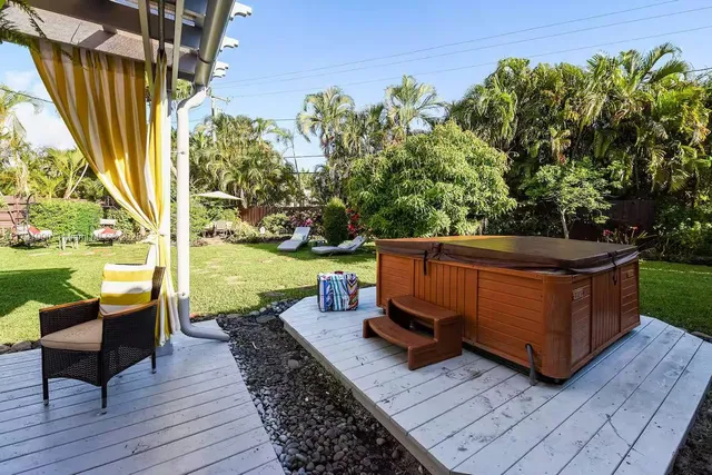 a view of a two chairs in the patio with a lake view