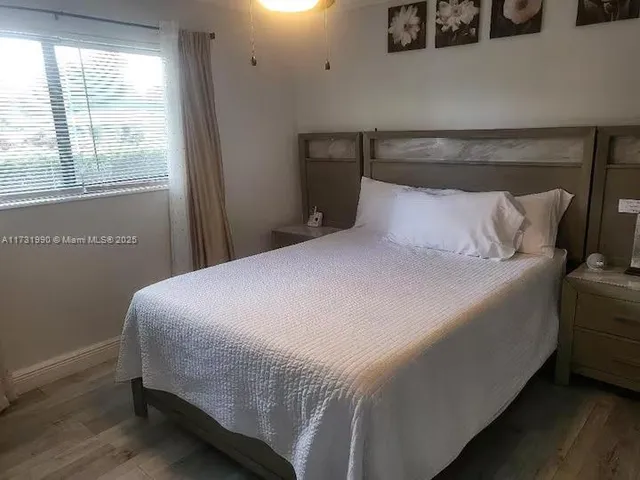 a view of a golf course with a tree