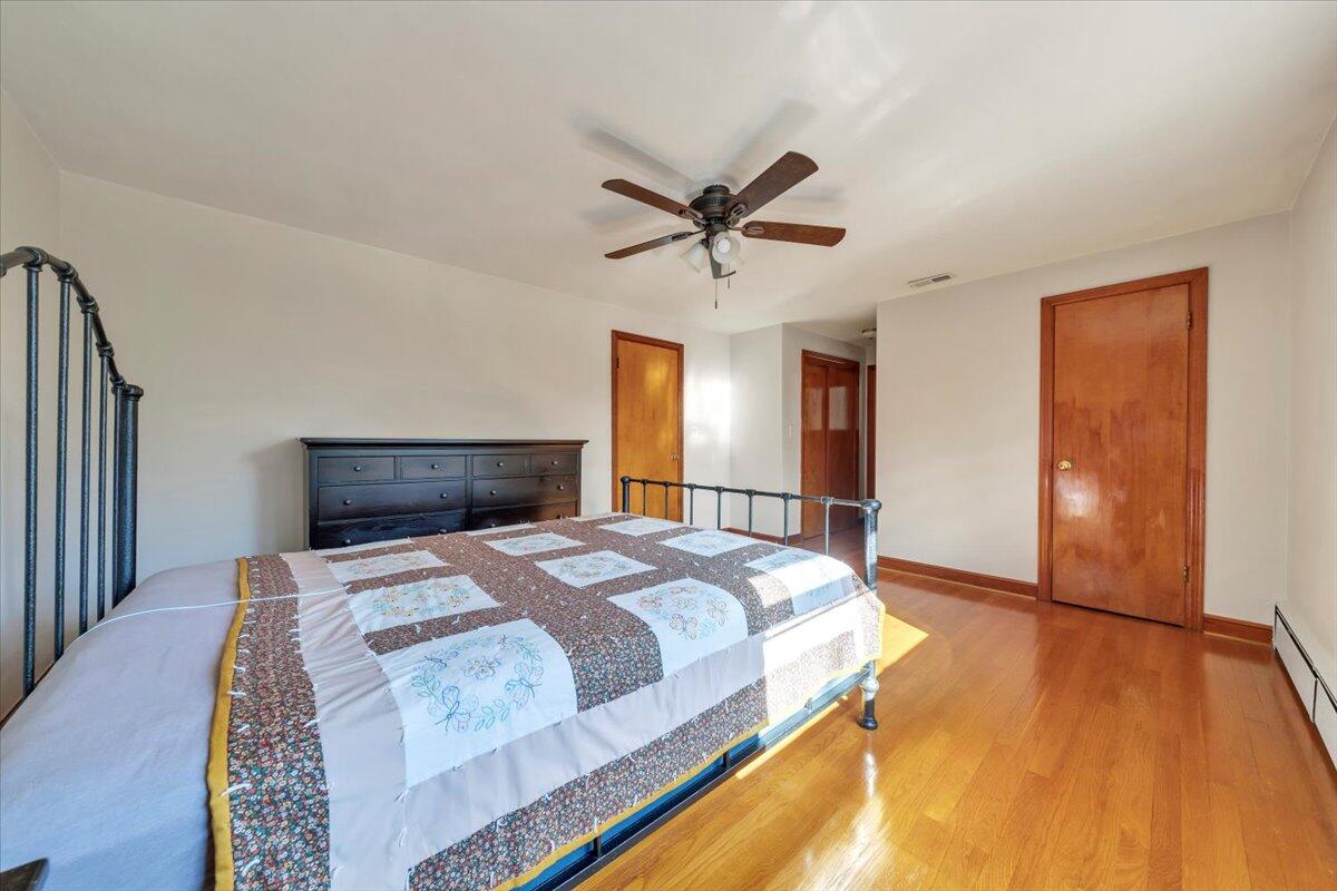 517 Boxley Road Roanoke, VA 24019 - Photo 34 of 76 a bedroom with a bed and a chandelier