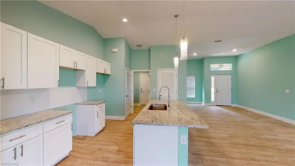 a large bathroom with a sink a mirror and a shower