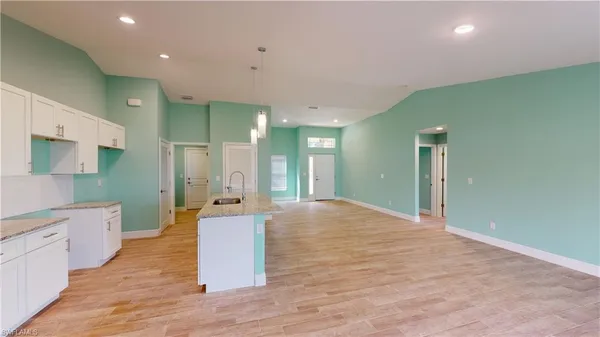 a large bathroom with a sink a large mirror and shower