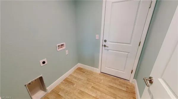 a view of a hallway with bathroom
