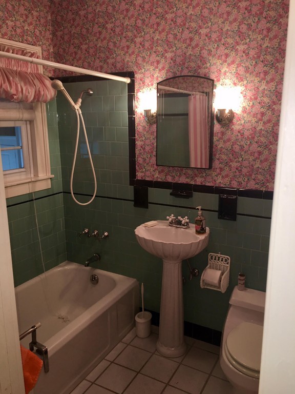 279 Mott Street Fall River, MA 02721 - Photo 12 of 19 a bathroom with a sink a toilet and a mirror