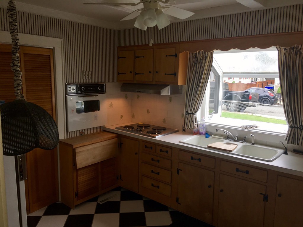 279 Mott Street Fall River, MA 02721 - Photo 9 of 19 a kitchen with stainless steel appliances a sink stove and cabinets