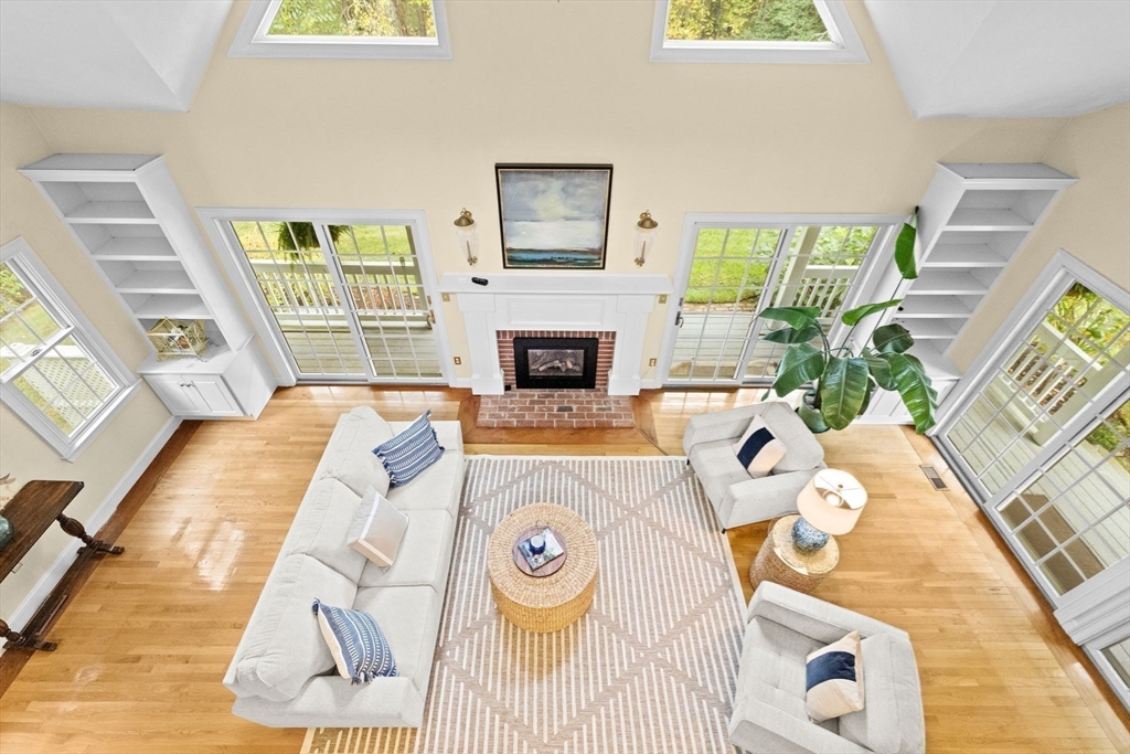 9 Forest Scituate Ma, Unit 9 Scituate, MA 02066 - Photo 12 of 41 a living room with a bed and a fireplace
