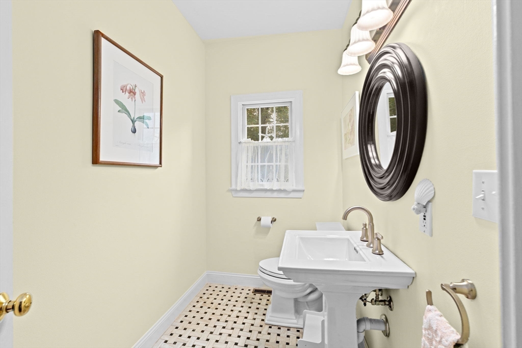 9 Forest Scituate Ma, Unit 9 Scituate, MA 02066 - Photo 16 of 41 a bathroom with a sink and a mirror