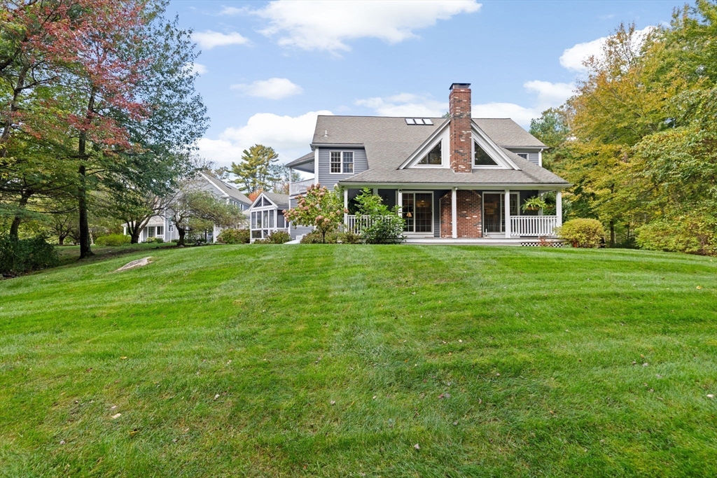 9 Forest Scituate Ma, Unit 9 Scituate, MA 02066 - Photo 2 of 41 a front view of a house with a garden