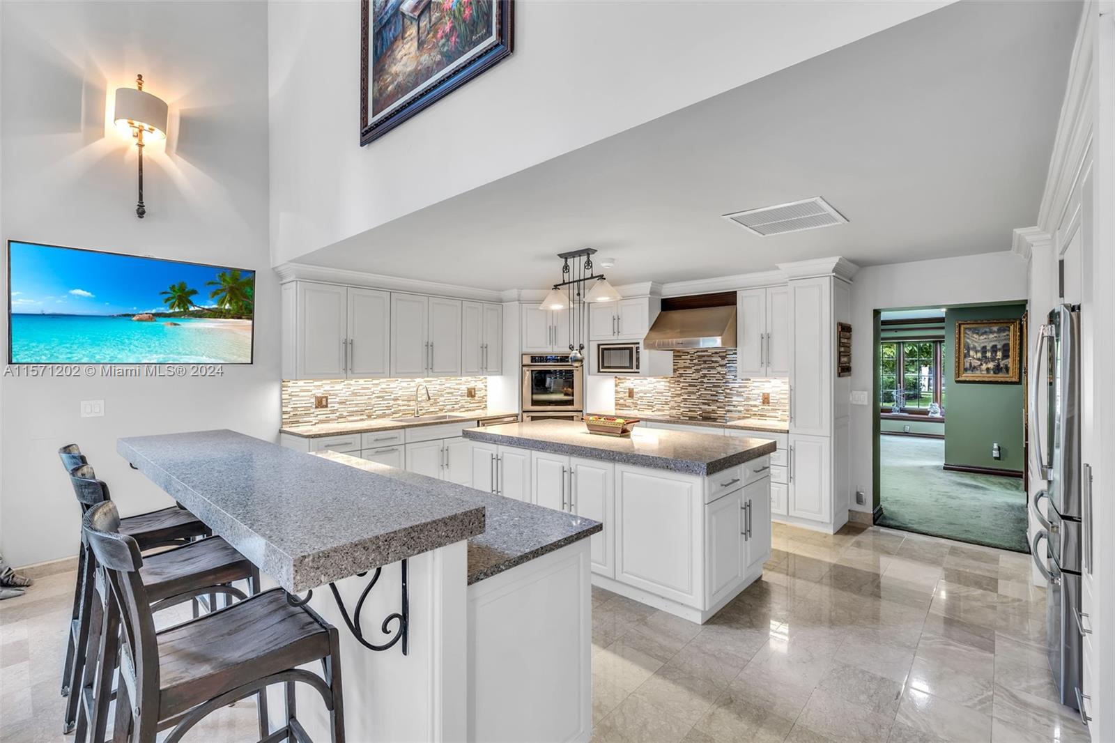 14600 Marvin Lane Southwest Ranches, FL 33330 - Photo 26 of 72 a kitchen with stainless steel appliances granite countertop a sink and a refrigerator