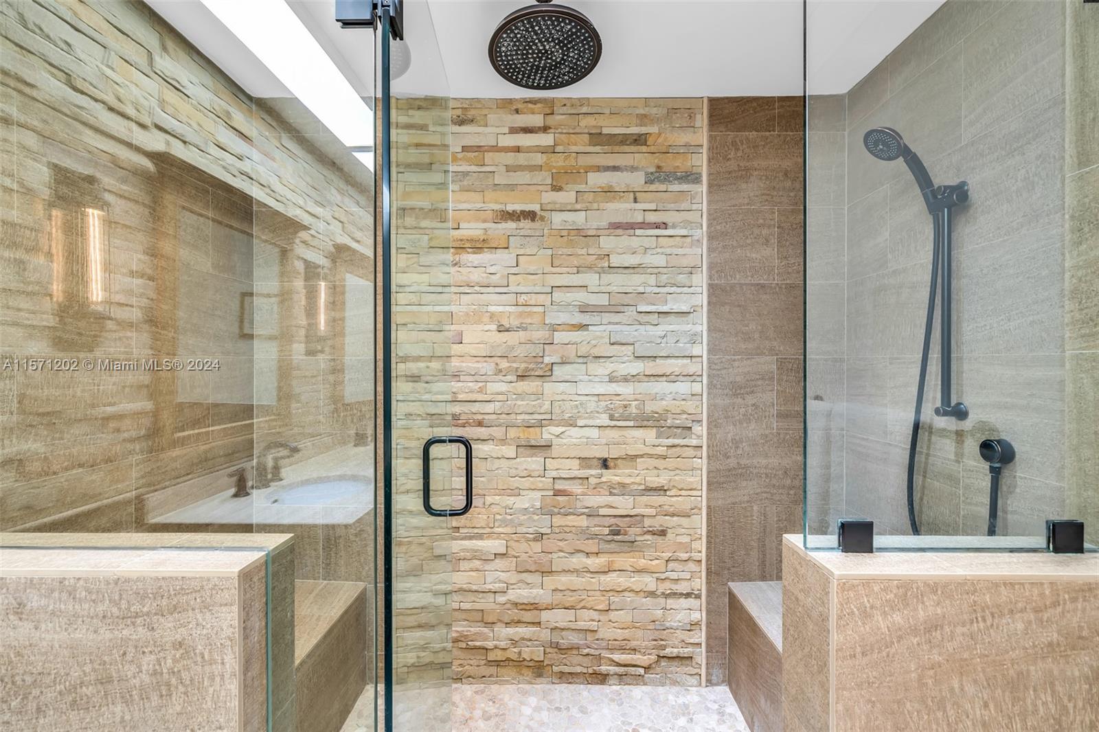 14600 Marvin Lane Southwest Ranches, FL 33330 - Photo 34 of 72 a bathroom with a granite countertop shower a sink and a shower