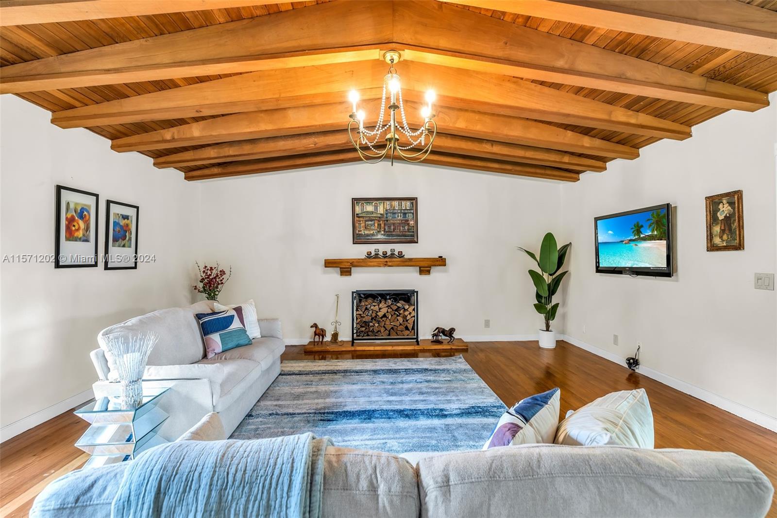 14600 Marvin Lane Southwest Ranches, FL 33330 - Photo 39 of 72 a living room with furniture pool table and paintings on the wall