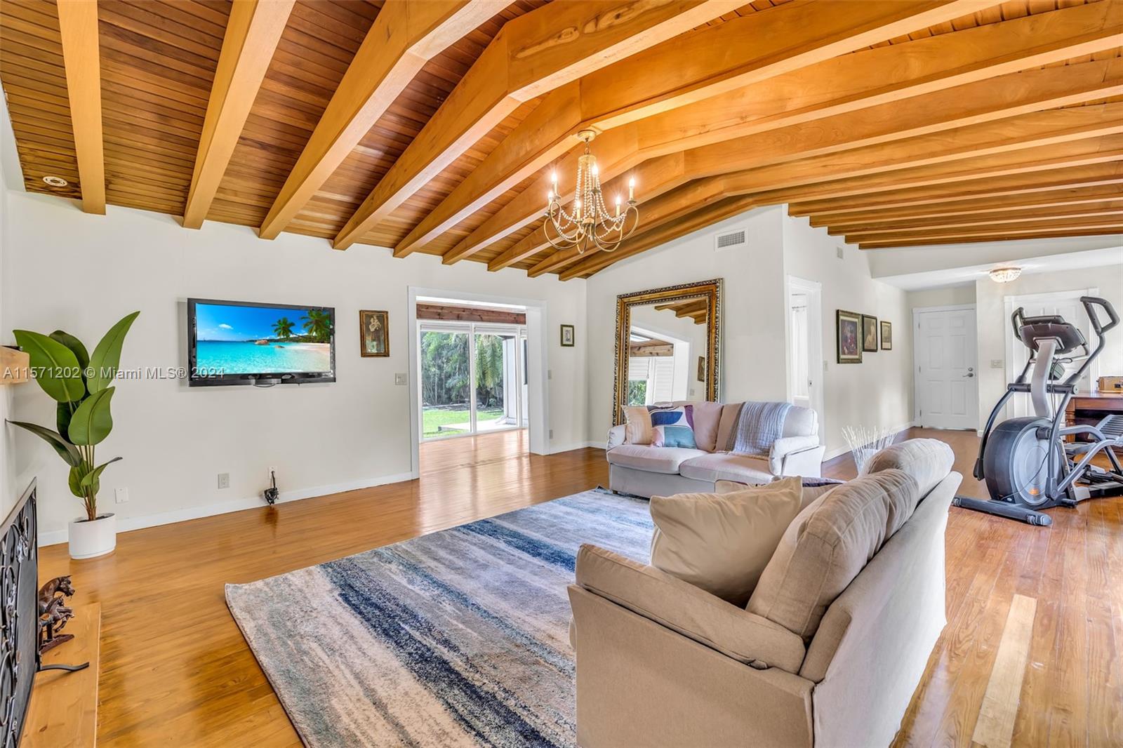 14600 Marvin Lane Southwest Ranches, FL 33330 - Photo 40 of 72 a living room with furniture and a flat screen tv
