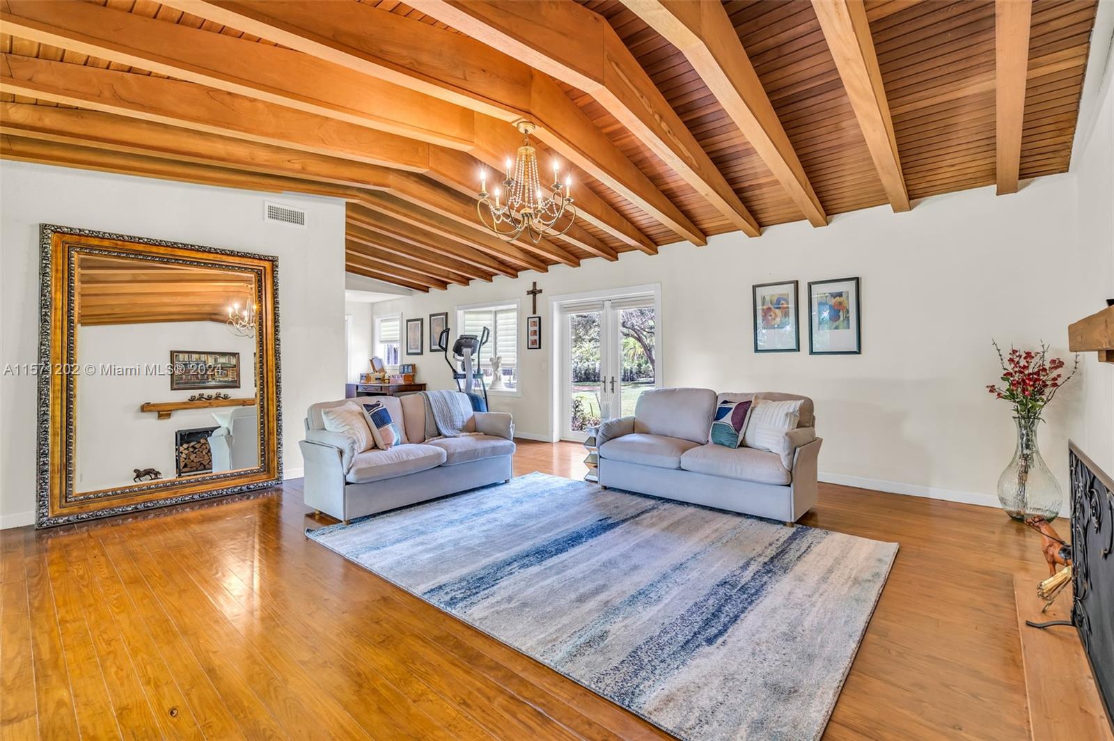 14600 Marvin Lane Southwest Ranches, FL 33330 - Photo 41 of 72 a living room with furniture and a wooden floor