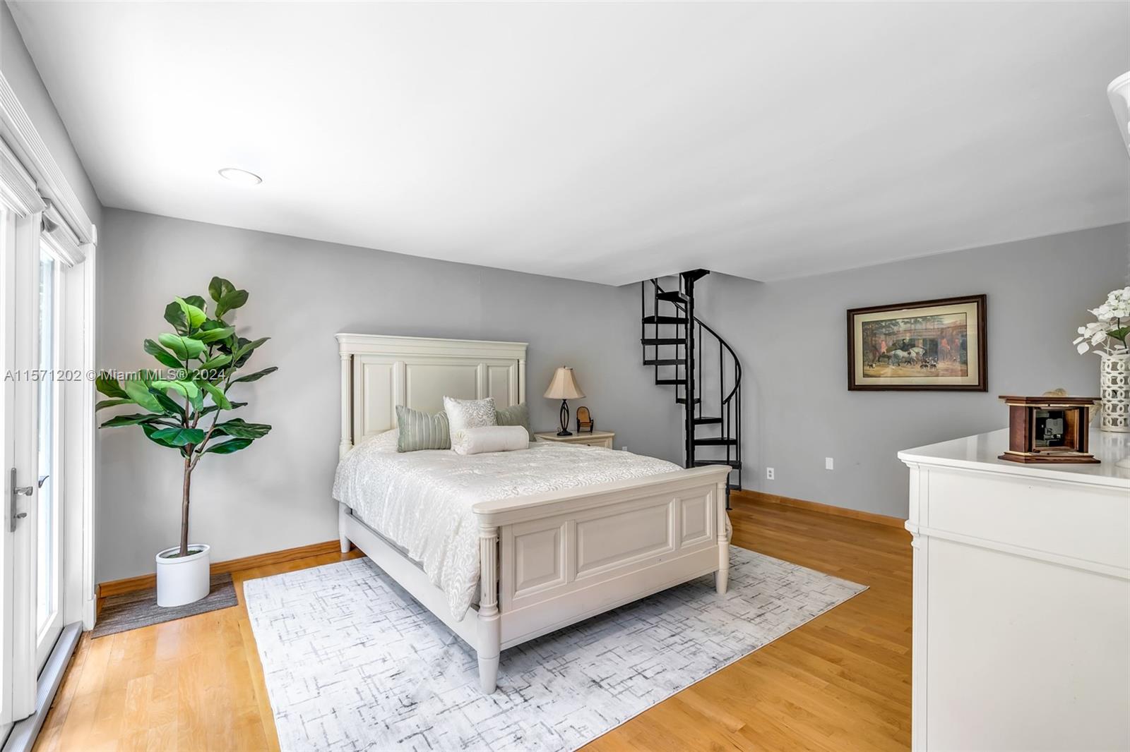 14600 Marvin Lane Southwest Ranches, FL 33330 - Photo 46 of 72 a bedroom with a bed and a potted plant