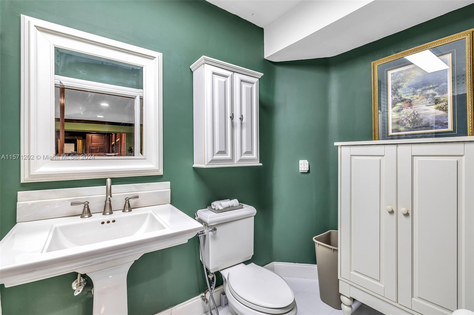 14600 Marvin Lane Southwest Ranches, FL 33330 - Photo 55 of 72 a bathroom with a toilet a sink and mirror