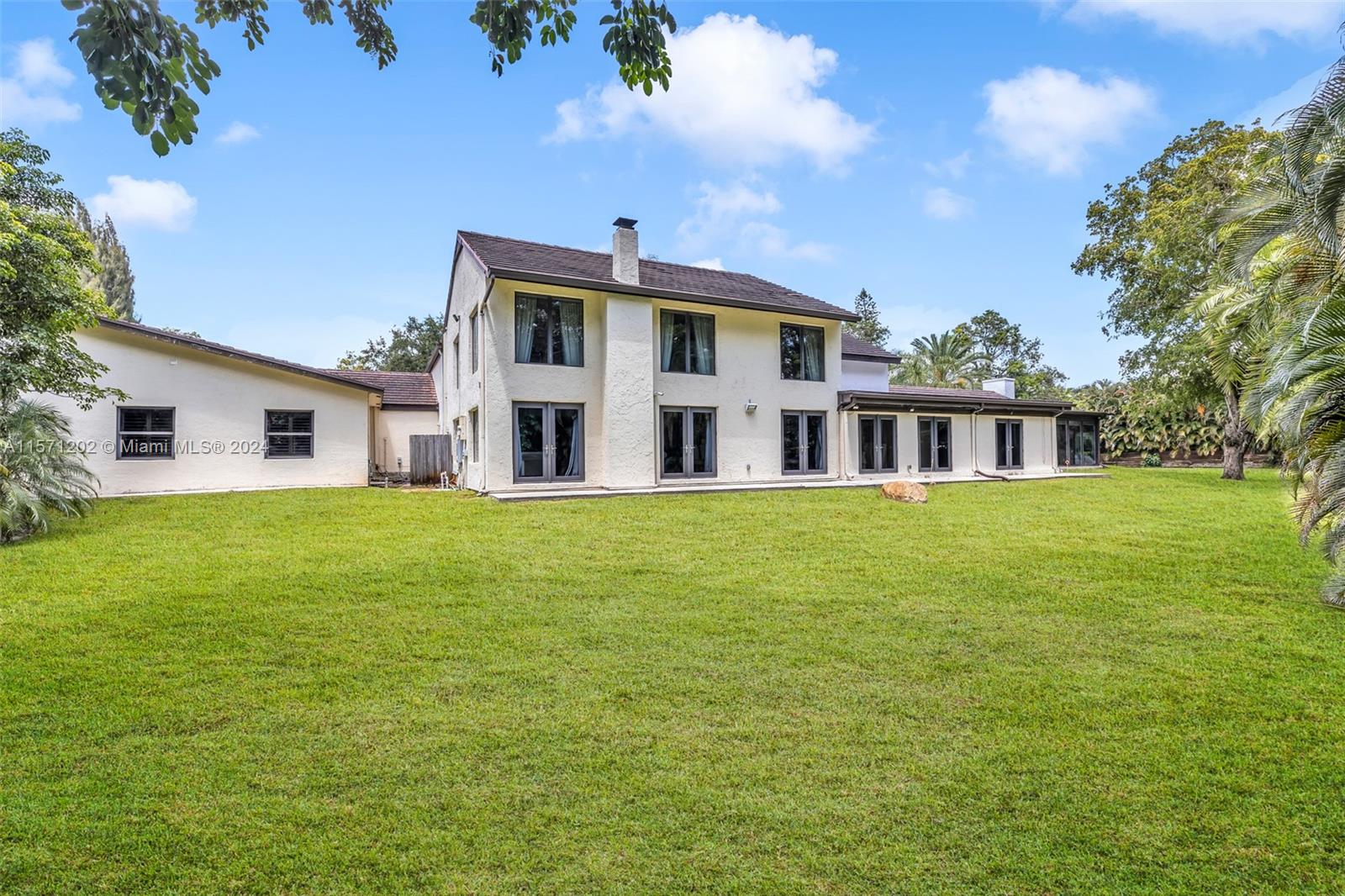 14600 Marvin Lane Southwest Ranches, FL 33330 - Photo 57 of 72 a front view of house with yard and green space