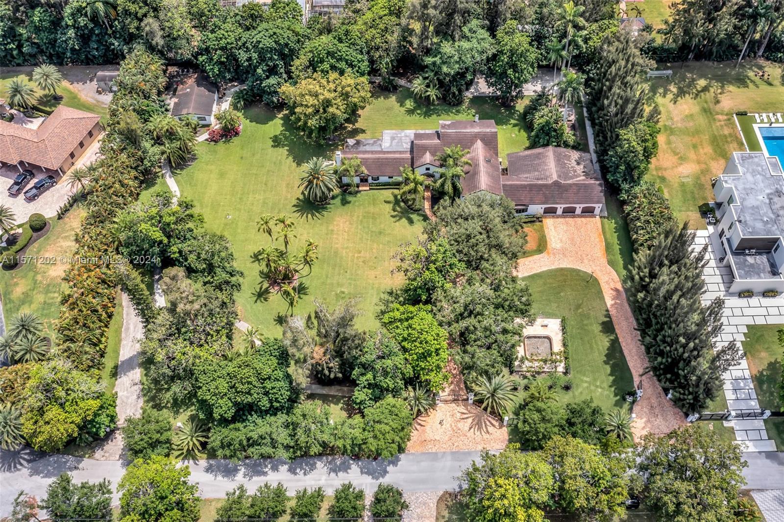 14600 Marvin Lane Southwest Ranches, FL 33330 - Photo 63 of 72 an aerial view of residential houses with outdoor space and lake view