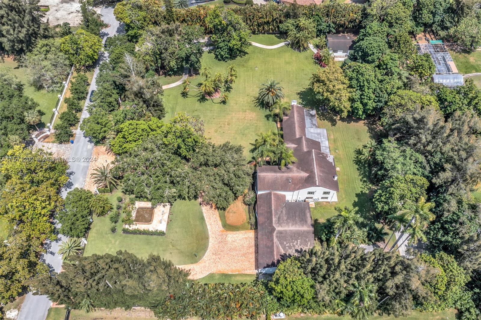 14600 Marvin Lane Southwest Ranches, FL 33330 - Photo 65 of 72 an aerial view of a house with a yard and lake view