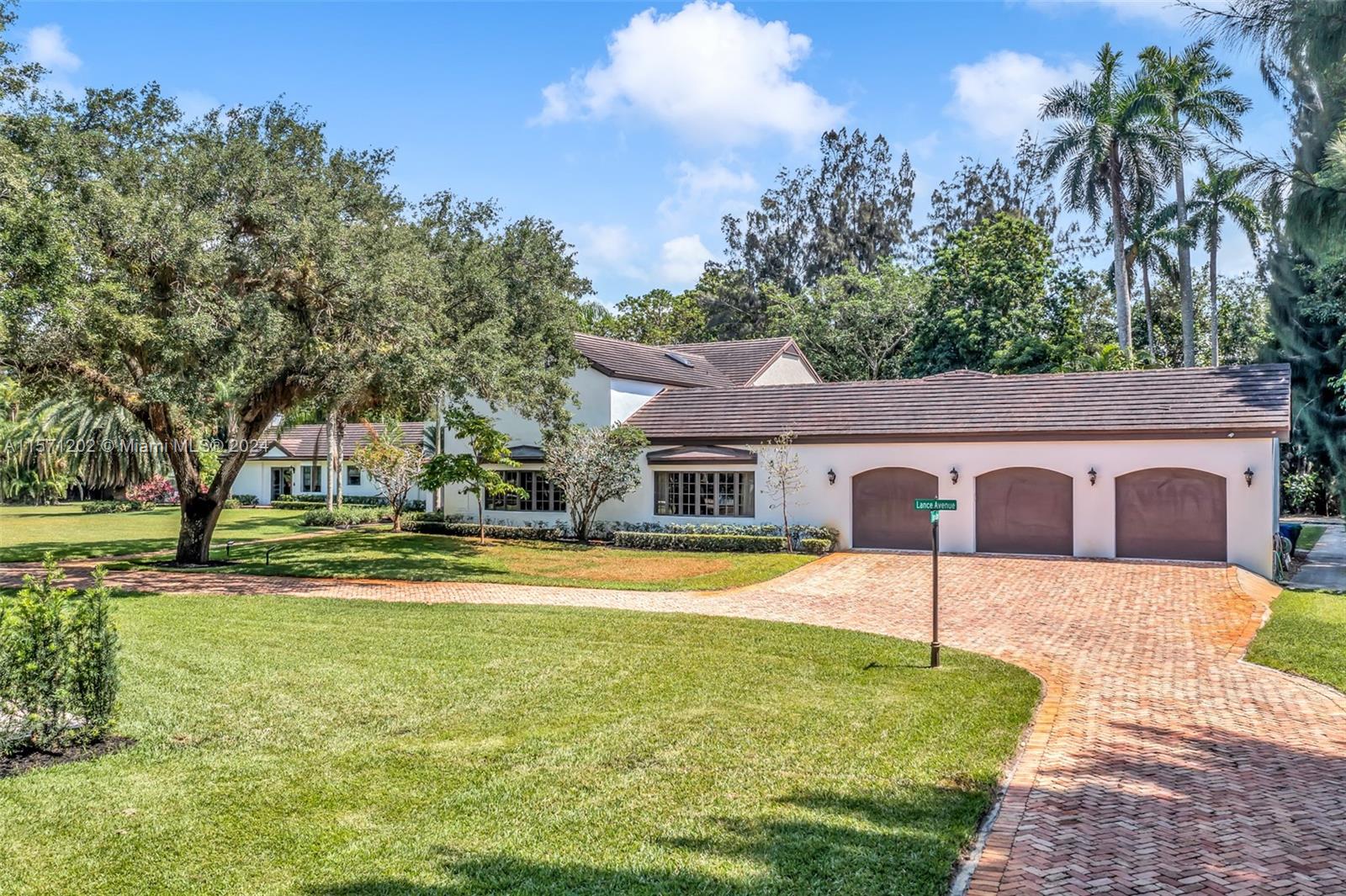 14600 Marvin Lane Southwest Ranches, FL 33330 - Photo 7 of 72 a front view of house with yard and trees in the background