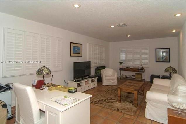 14600 Marvin Lane Southwest Ranches, FL 33330 - Photo 71 of 72 a living room with furniture and a flat screen tv