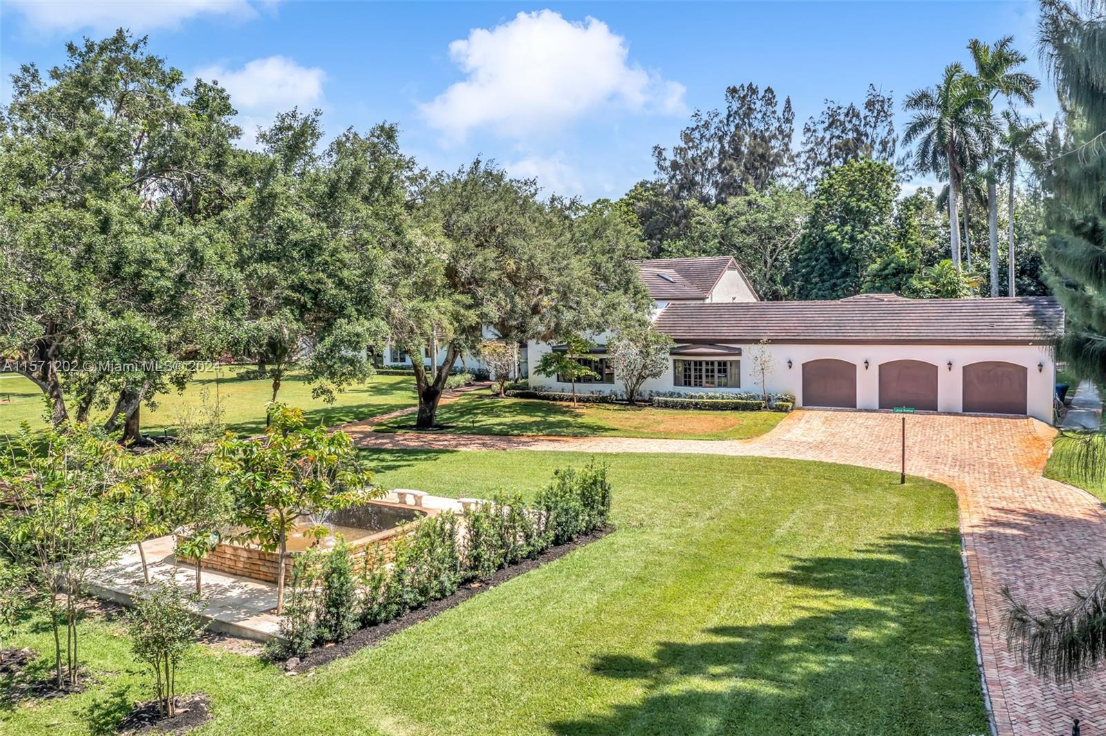 14600 Marvin Lane Southwest Ranches, FL 33330 - Photo 10 of 72 a front view of house with yard and trees
