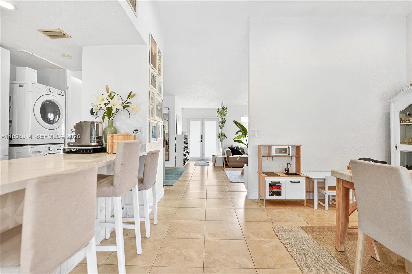 752 Northwest 134th Avenue Miami, FL 33182 - Photo 11 of 47 a living room with furniture and a table