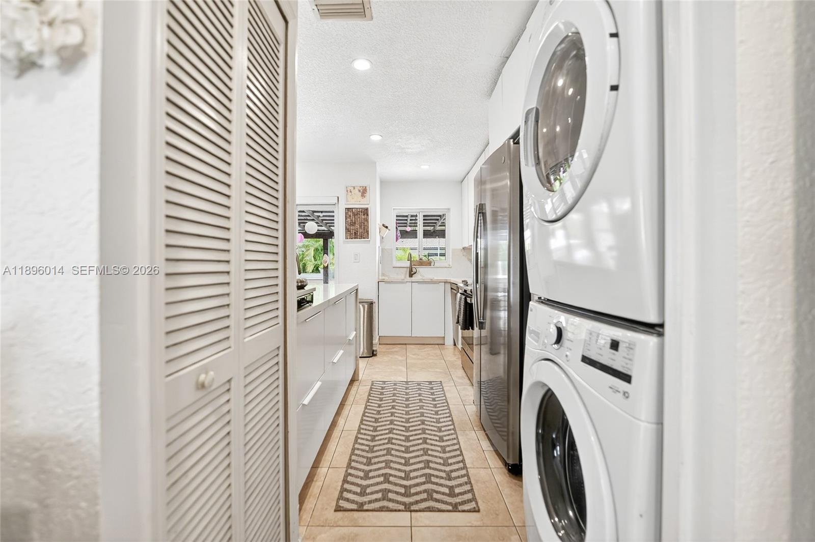 752 Northwest 134th Avenue Miami, FL 33182 - Photo 12 of 47 a view of a hallway with washer and dryer