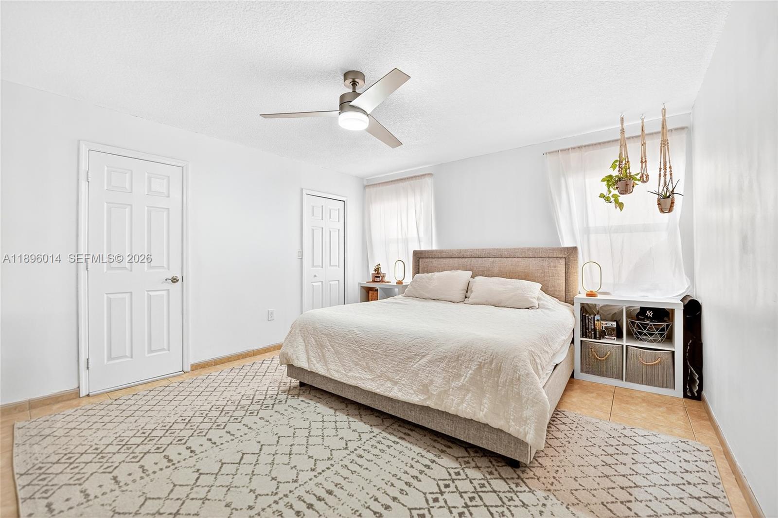 752 Northwest 134th Avenue Miami, FL 33182 - Photo 15 of 47 a bedroom with a bed and ceiling fan