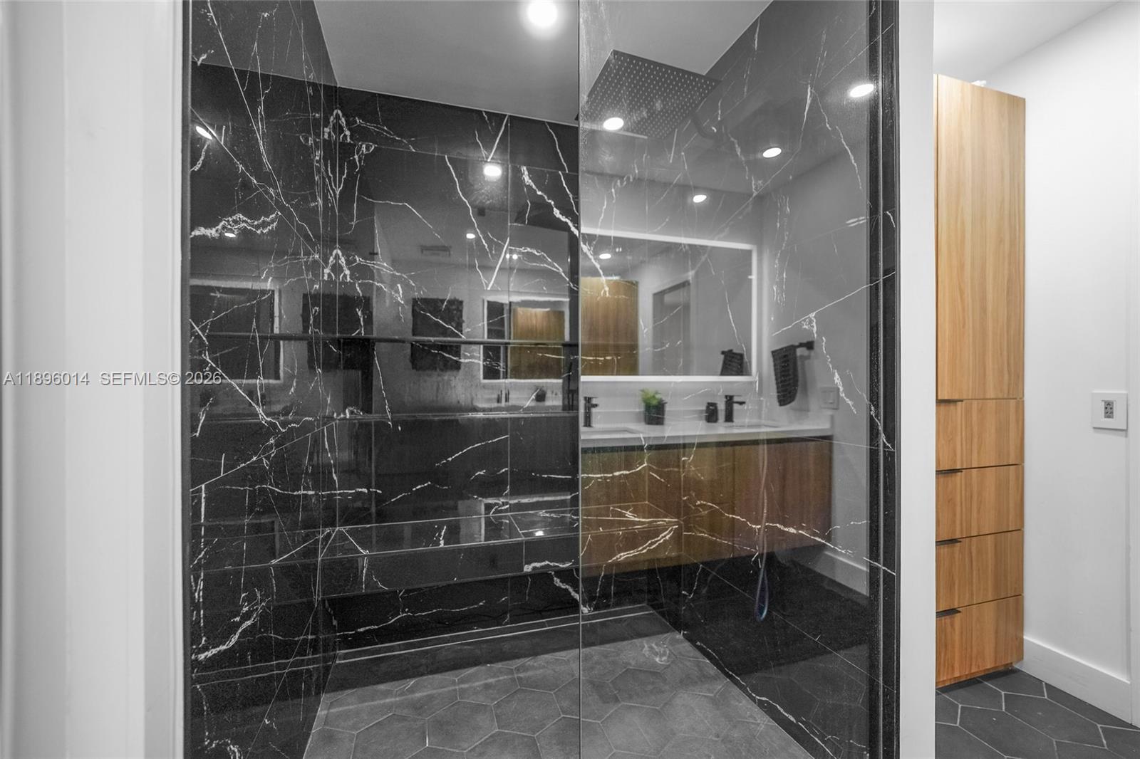 752 Northwest 134th Avenue Miami, FL 33182 - Photo 17 of 47 a bathroom with a glass shower door and a sink