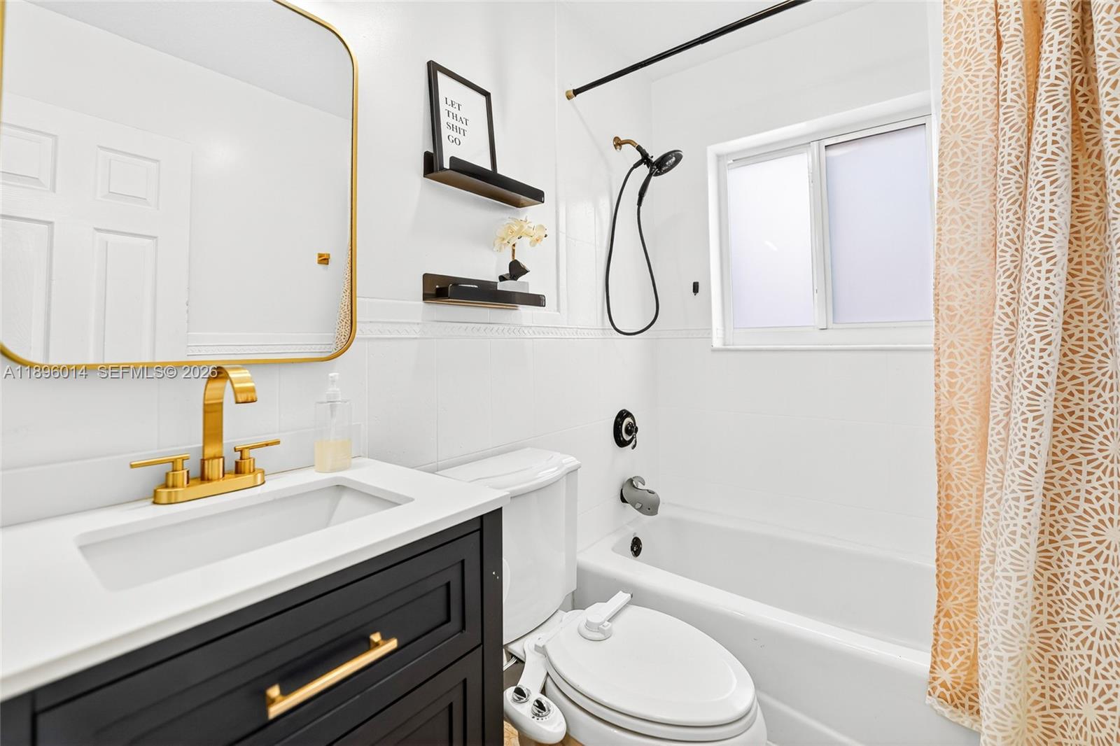 752 Northwest 134th Avenue Miami, FL 33182 - Photo 23 of 47 a bathroom with a sink a toilet and shower