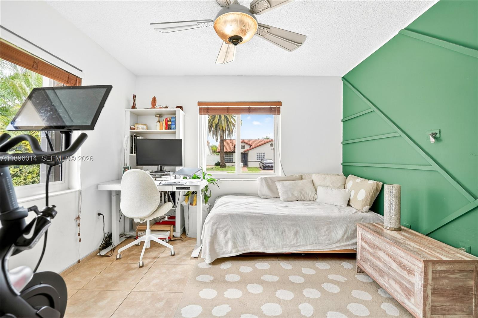 752 Northwest 134th Avenue Miami, FL 33182 - Photo 24 of 47 a living room with furniture a flat screen tv and a window