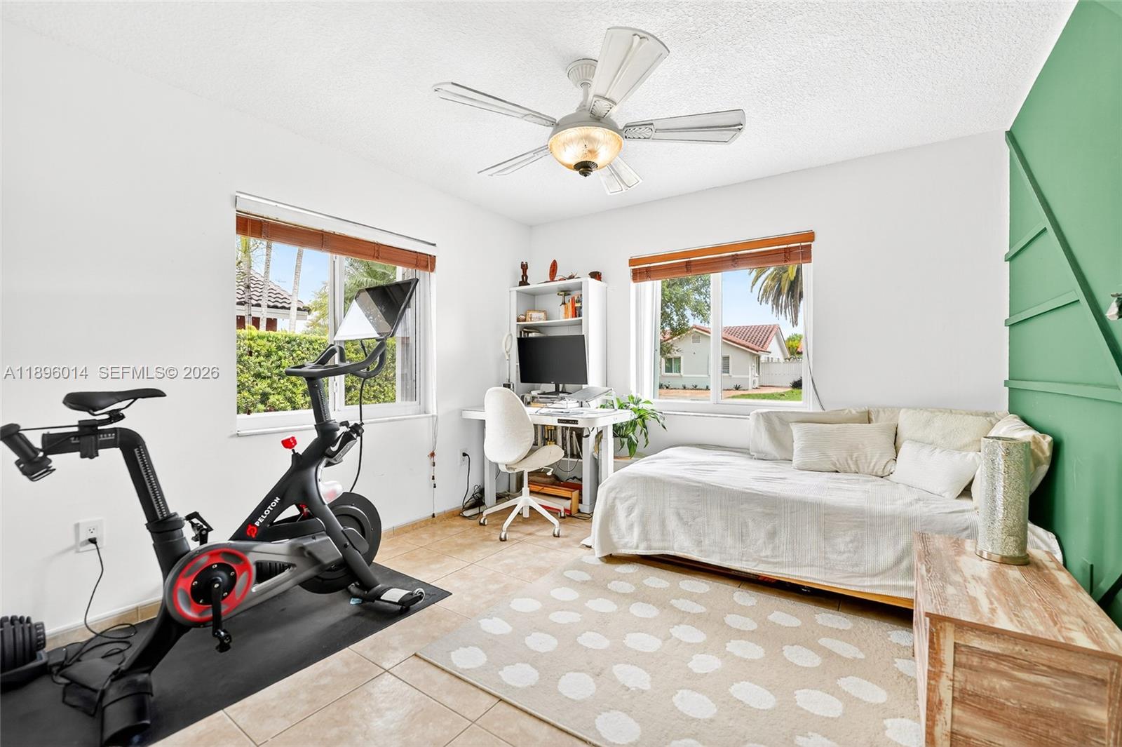 752 Northwest 134th Avenue Miami, FL 33182 - Photo 26 of 47 a bedroom with furniture a flat screen tv and a window