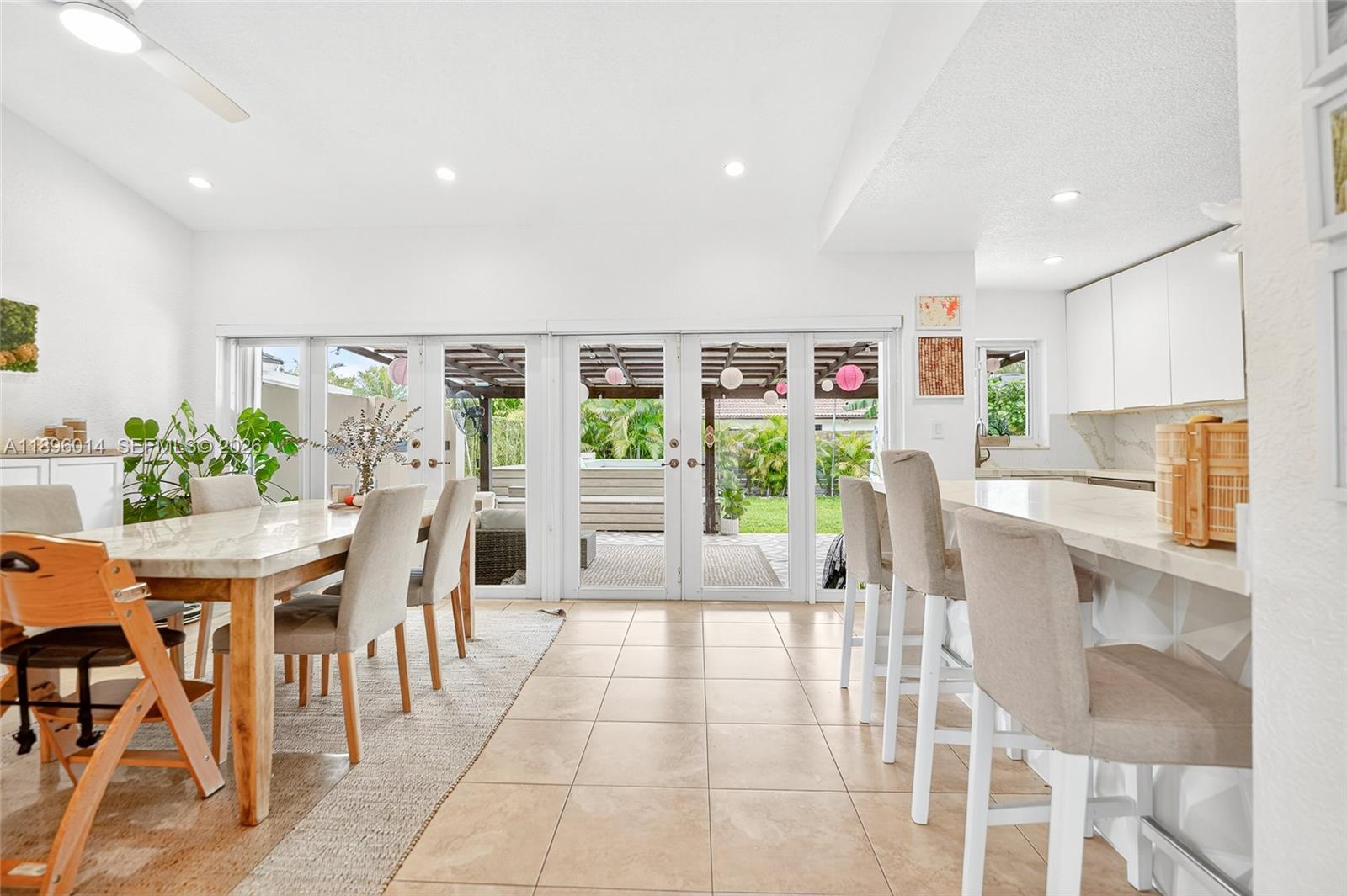 752 Northwest 134th Avenue Miami, FL 33182 - Photo 3 of 47 a dining room with furniture and a floor to ceiling window