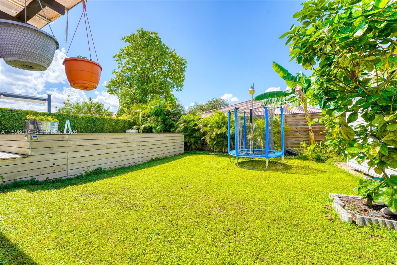 752 Northwest 134th Avenue Miami, FL 33182 - Photo 32 of 47 a view of a swimming pool with an outdoor space and seating area