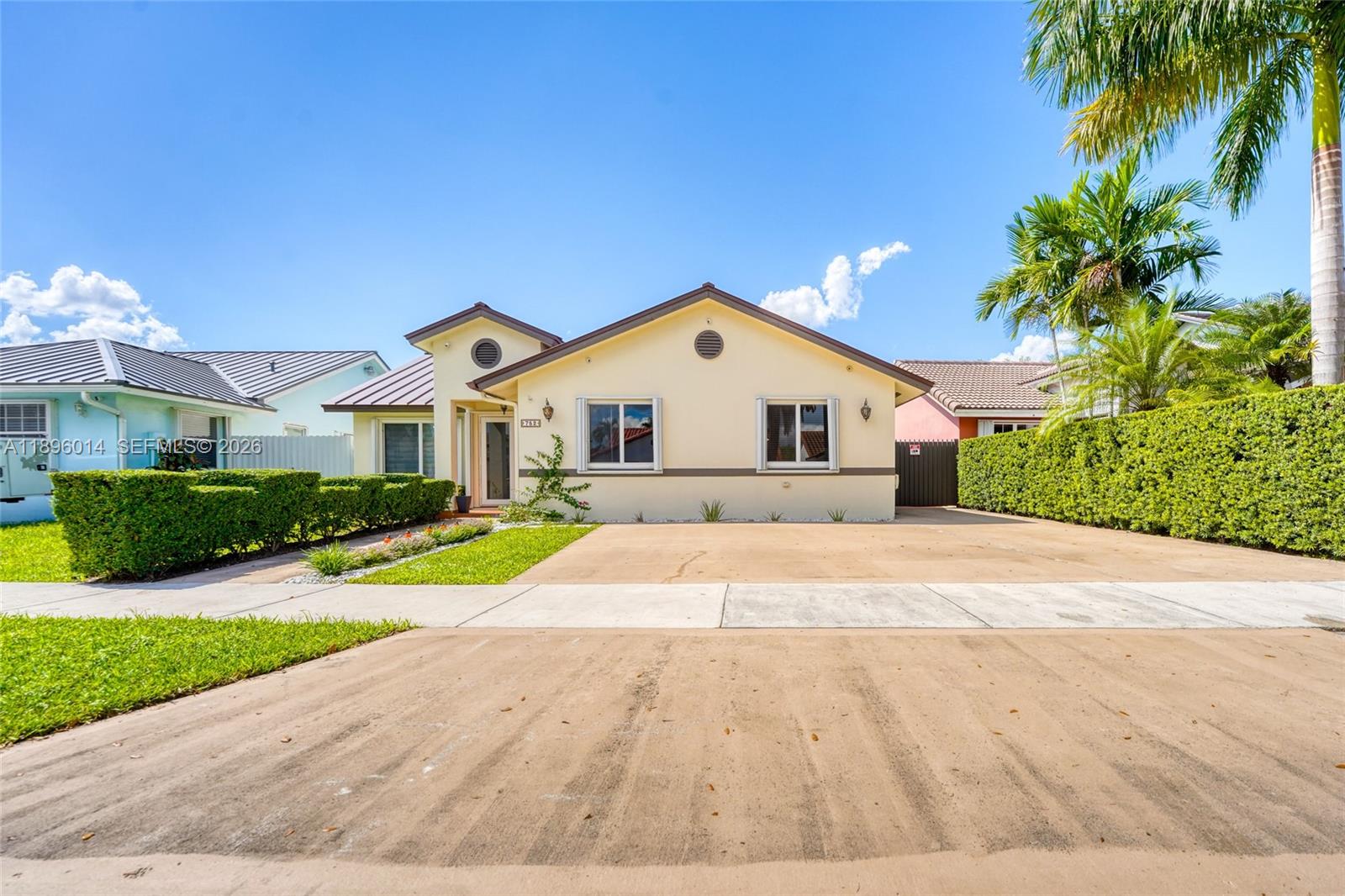 752 Northwest 134th Avenue Miami, FL 33182 - Photo 42 of 47 a front view of a house with a yard and garage