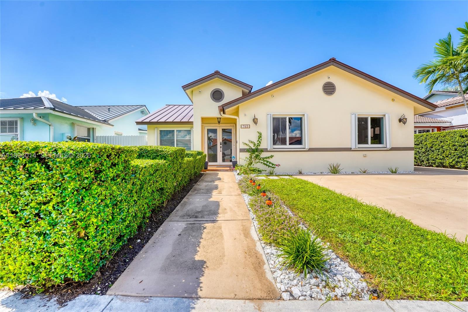 752 Northwest 134th Avenue Miami, FL 33182 - Photo 44 of 47 a front view of house with yard and green space