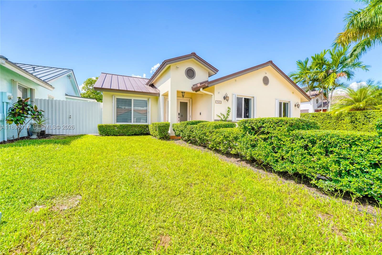752 Northwest 134th Avenue Miami, FL 33182 - Photo 46 of 47 a front view of a house with yard and green space