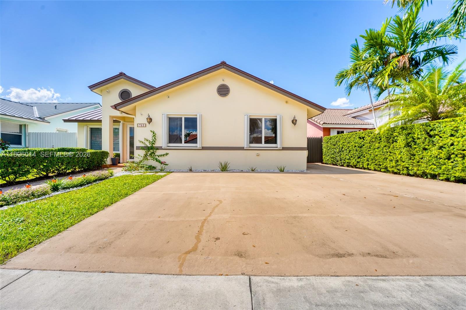 752 Northwest 134th Avenue Miami, FL 33182 - Photo 47 of 47 a front view of a house with a yard and garage